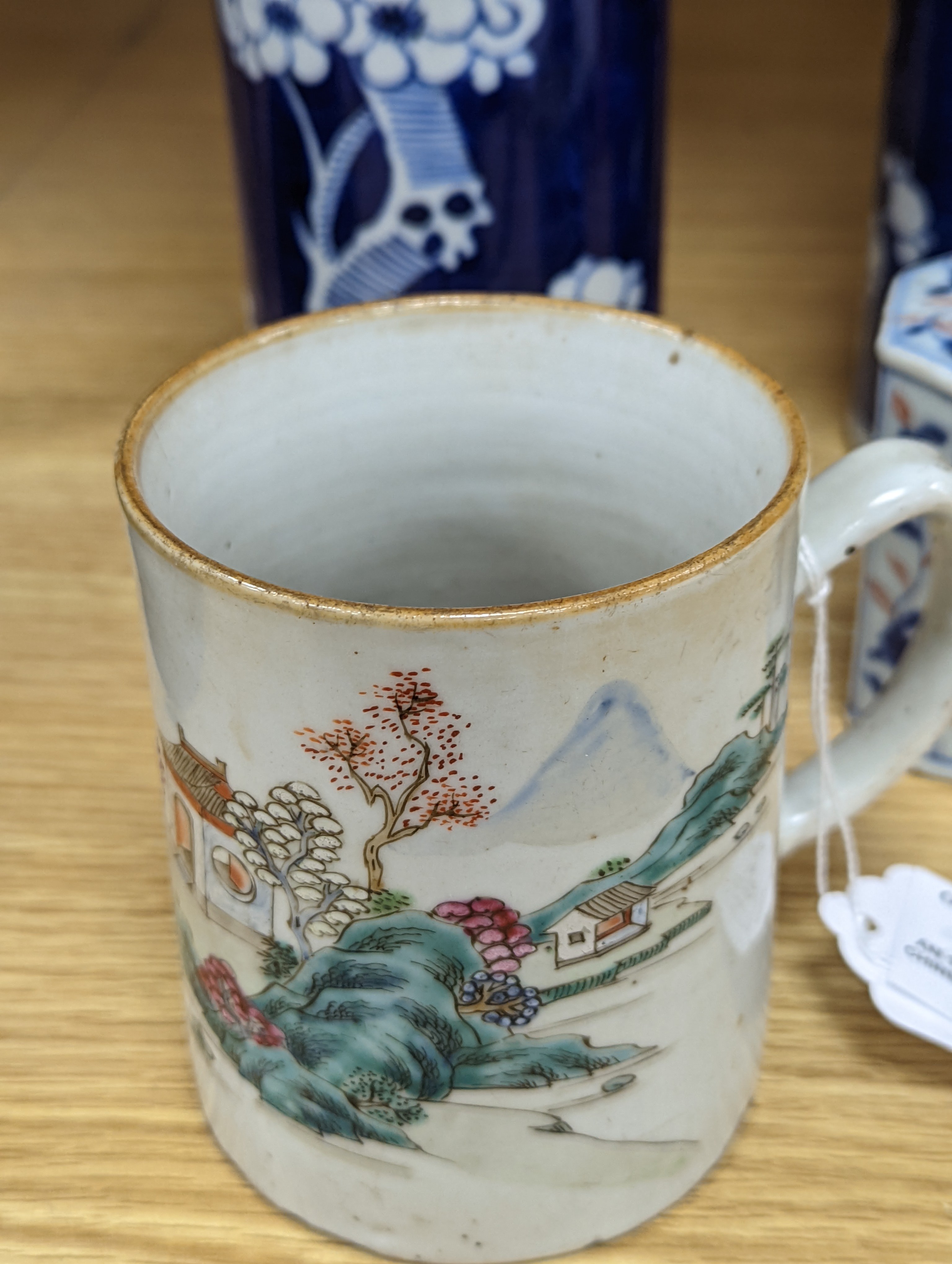 An 18th century Chinese famille rose mug, a Chinese Imari tea caddy and two Chinese blue and white sleeve vases 30cm (4)
